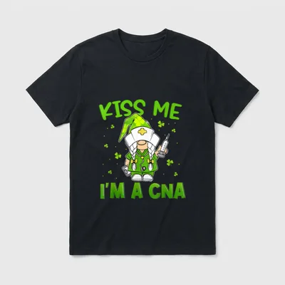 Gnomies Kiss Me I'm a CNA T-Shirt – Nurse gnome in green scrubs holding a syringe and clipboard – Classic T-Shirt in Black