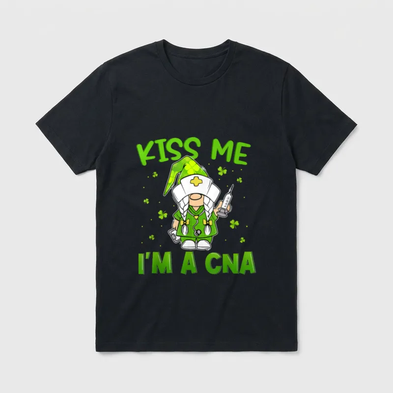 Gnomies Kiss Me I'm a CNA T-Shirt – Nurse gnome in green scrubs holding a syringe and clipboard – Classic T-Shirt in Black