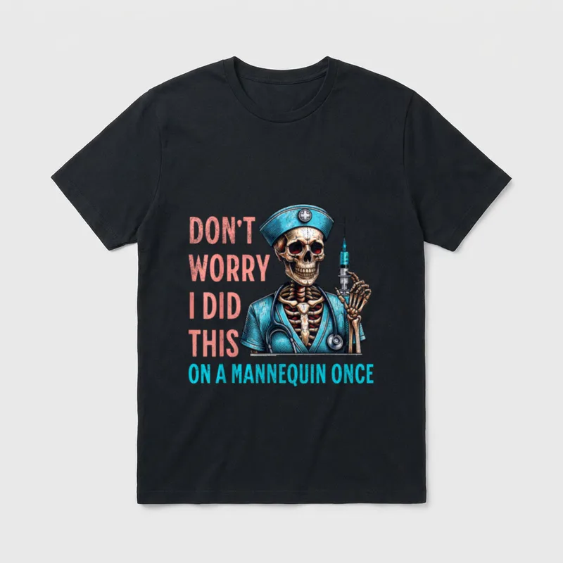 Skeleton Nurse Worry T-Shirt – Skeleton nurse holding syringe with mannequin humor text – Classic T-Shirt in Black