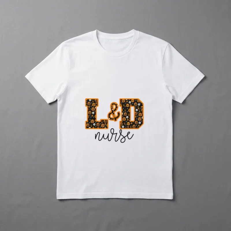 Halloween Labor and Delivery Nurse T-Shirt – “L&D” in pumpkin pattern above cursive “nurse” – Classic T-Shirt in Black