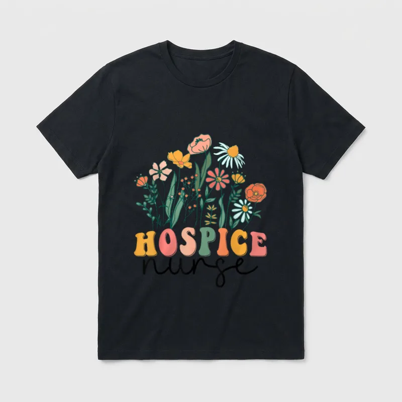 Groovy Wildflower Hospice Nurse T-Shirt – Wildflowers above colorful Hospice text and nurse script – Classic T-Shirt in Black