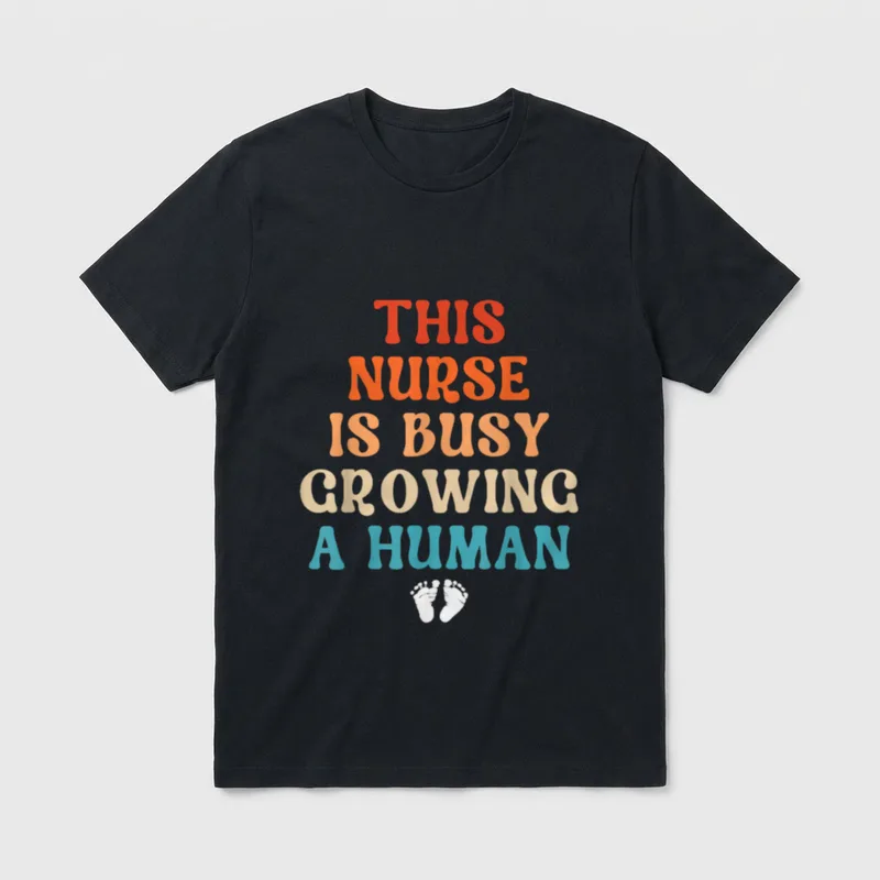 Pregnancy Nurse Announcement Cute Pregnant T-Shirt – “THIS NURSE IS BUSY GROWING A HUMAN” – Classic T-Shirt in Black