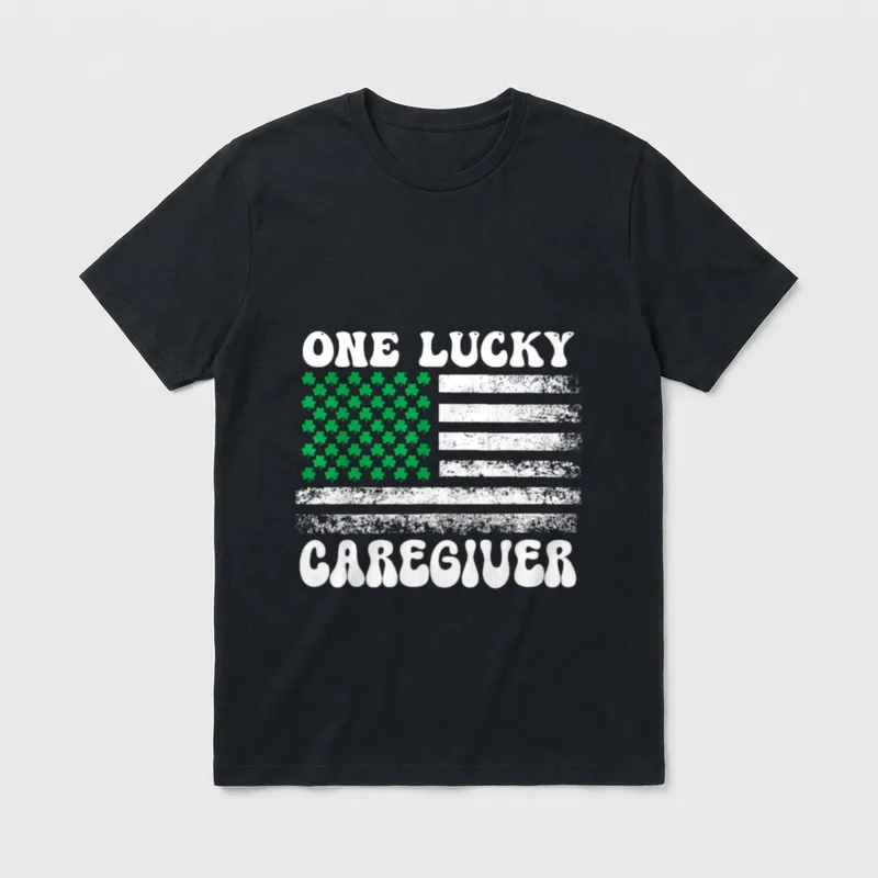 Lucky Caregiver St Day Nurse T-Shirt – ONE LUCKY CAREGIVER text with distressed shamrock flag – Classic T-Shirt in Black
