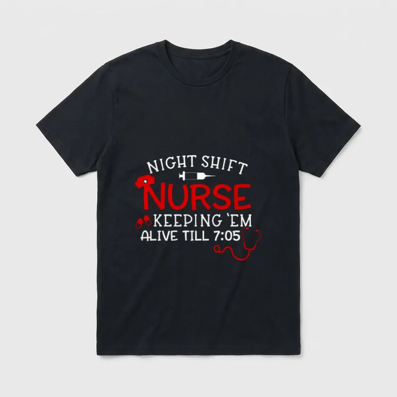 Keeping Them Alive Till 7 Nurse T-Shirt – “NIGHT SHIFT NURSE KEEPING ’EM ALIVE TILL 7:05” graphic – Classic T-Shirt in Black